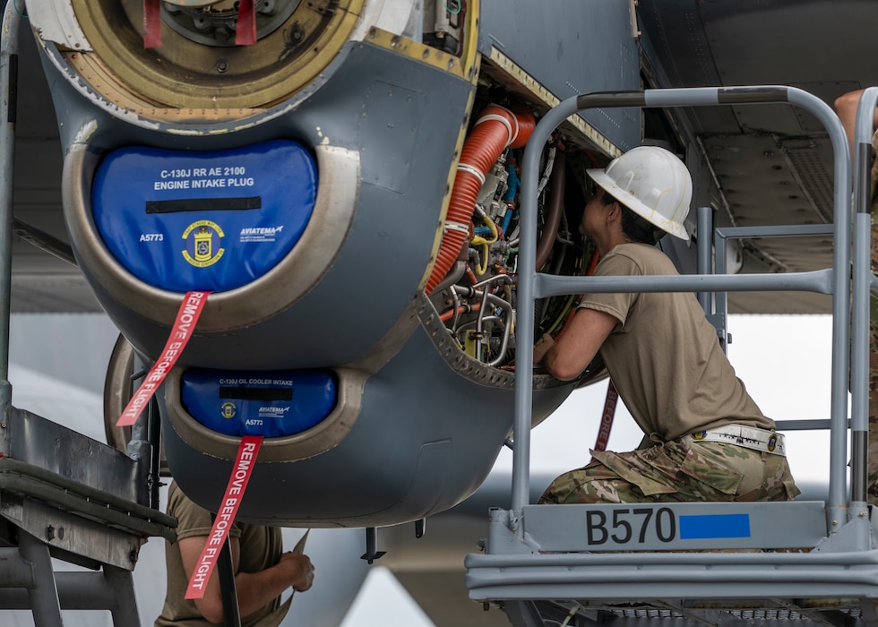 U.S. Air Force Airman 1st Class Jacob Kenotich assigned to the 71st Rescue Generation Squadron works on an HC-130J Combat King II engine at Moody Air Force Base, Georgia, May 20, 2024. During a visit from a Mercer Engineering Research Center team, they were able to collect data and learn from the subject matter experts and technicians at Moody. (U.S. Air Force photo by Airman 1st Class Leonid Soubbotine)