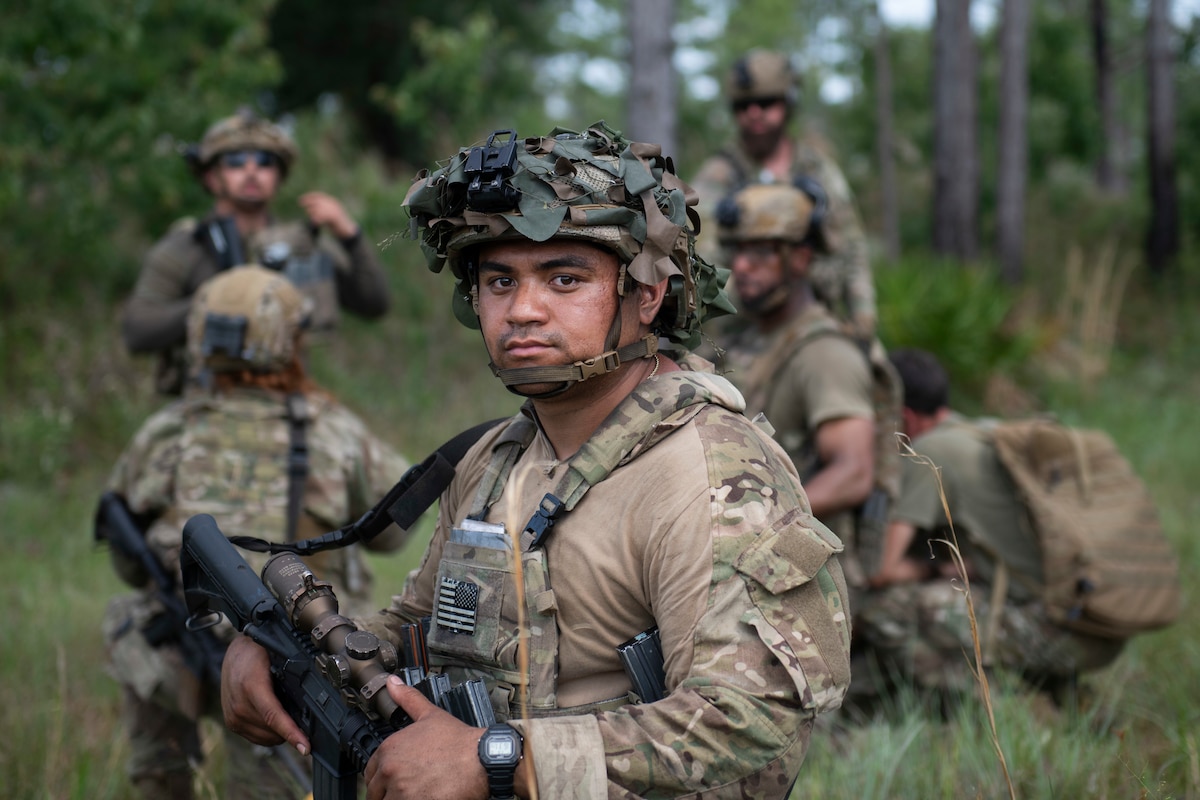 Airman kneels