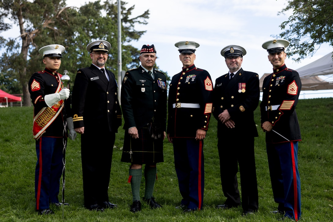 From left to right, U.S. Marine Corps Sgt. Jonathan Schneider, assistant drum major with the 3rd Marine Aircraft Wing Band; Royal Canadian Navy Lt. Ben Van Slyke, commanding officer of the Naden Band; Canadian Army Lt. Col. Slade Lerch, commanding officer of Canadian Scottish Regiment; U.S. Marine Corps Master Gunnery Sgt. Devon Van, staff non-commissioned officer in charge with 3rd MAW Band; Royal Canadian Navy Chief Petty Officer 2nd Class Daniel Keels; and U.S. Marine Corps Gunnery Sgt. Justin Grunes, enlisted conductor with 3rd MAW Band, pose for a photograph during the Victoria Highland Games and Celtic Festival at Victoria, British Columbia, Canada, May 18, 2024. The 3rd MAW Band performed alongside the Canadian Forces Bands, honoring the longstanding partnership and shared values between the U.S. and Canada. (U.S. Marine Corps photo by Lance Cpl. Samantha Devine)