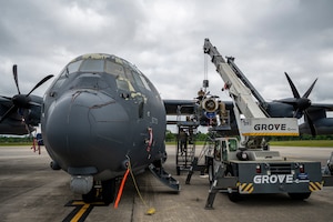 U.S. Air Force Airmen assigned to the 71st Rescue Generation Squadron work on a HC-130J Combat King II engine at Moody Air Force Base, Georgia, May 20, 2024. A team of engineers from Mercer Engineering Research Center were able to observe and learn about the process of an engine replacement. (U.S. Air Force photo by Airman 1st Class Leonid Soubbotine)