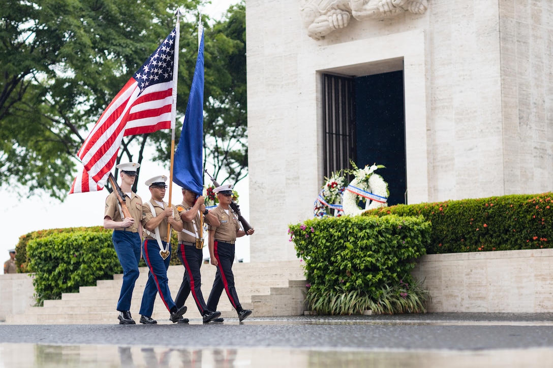 Service members of the Philippine Marine Corps and U.S. Marine Corps retire the colors during a Memorial Day ceremony at the Manila American Cemetery and Memorial in Manila, Philippines, May 26, 2024. The ceremony commemorated the sacrifices of Filipino and American service members who lost their lives in the Philippines and New Guinea during World War II. (U.S. Marine Corps photo by Staff Sgt. Dana Beesley)