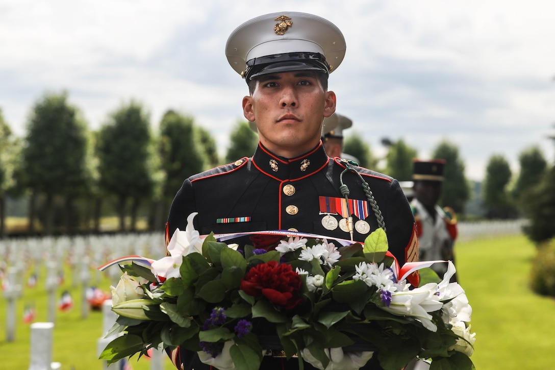U.S. Marine Corps Sgt. Ryan Leblanc, a squad leader with 1st Battalion, 6th Marine Regiment, 2d Marine Division, holds a wreath during a ceremony at the Aisne-Marne American Cemetery, Belleau, France, May 26, 2024. The memorial ceremony was held in commemoration of the 106th anniversary of the battle of Belleau Wood, conducted to honor the legacy of service members who gave their lives in defense of the United States and European allies. (U.S. Marine Corps photo by Sgt. Alexa M. Hernandez)