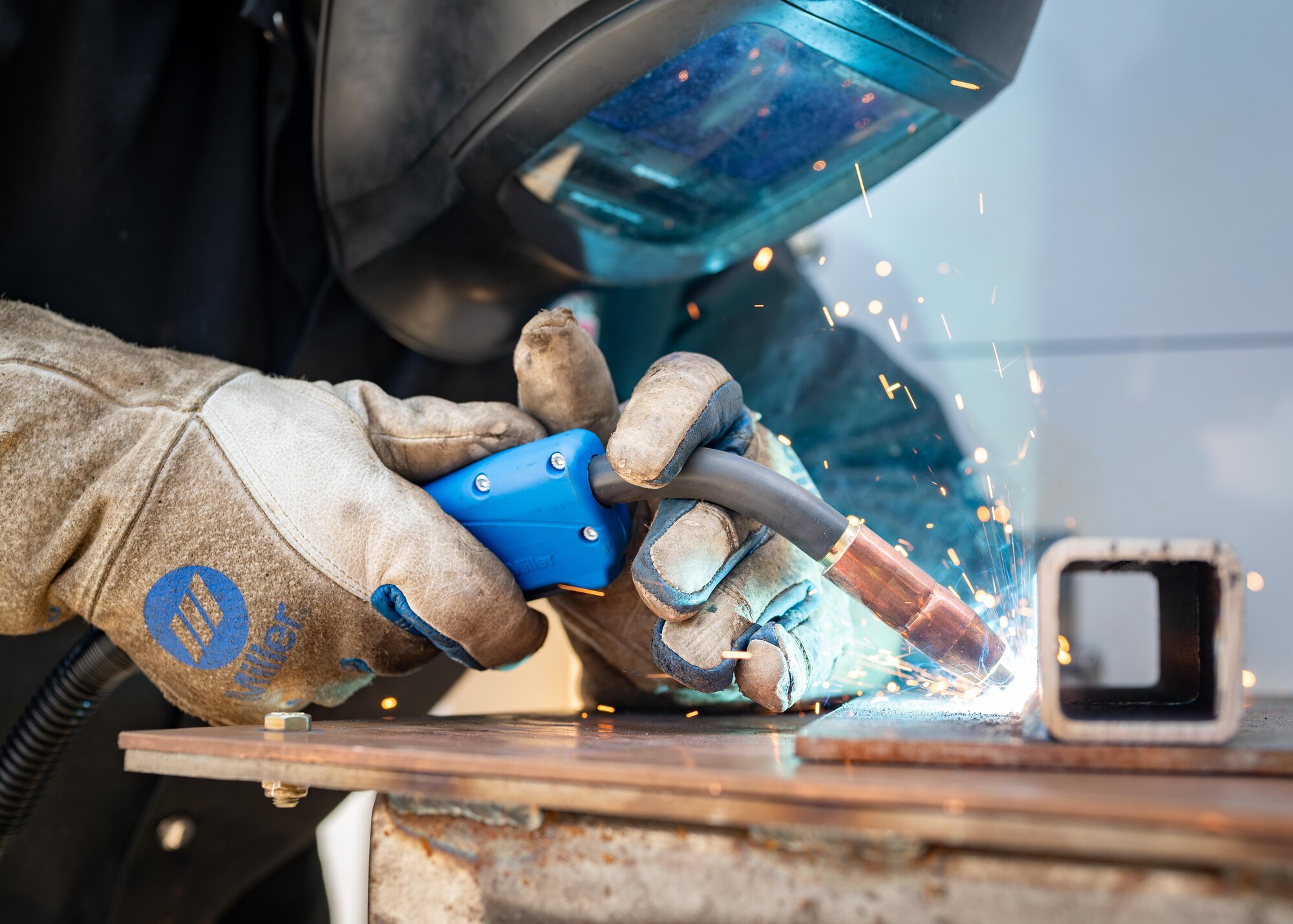 An Airman performs a weld.