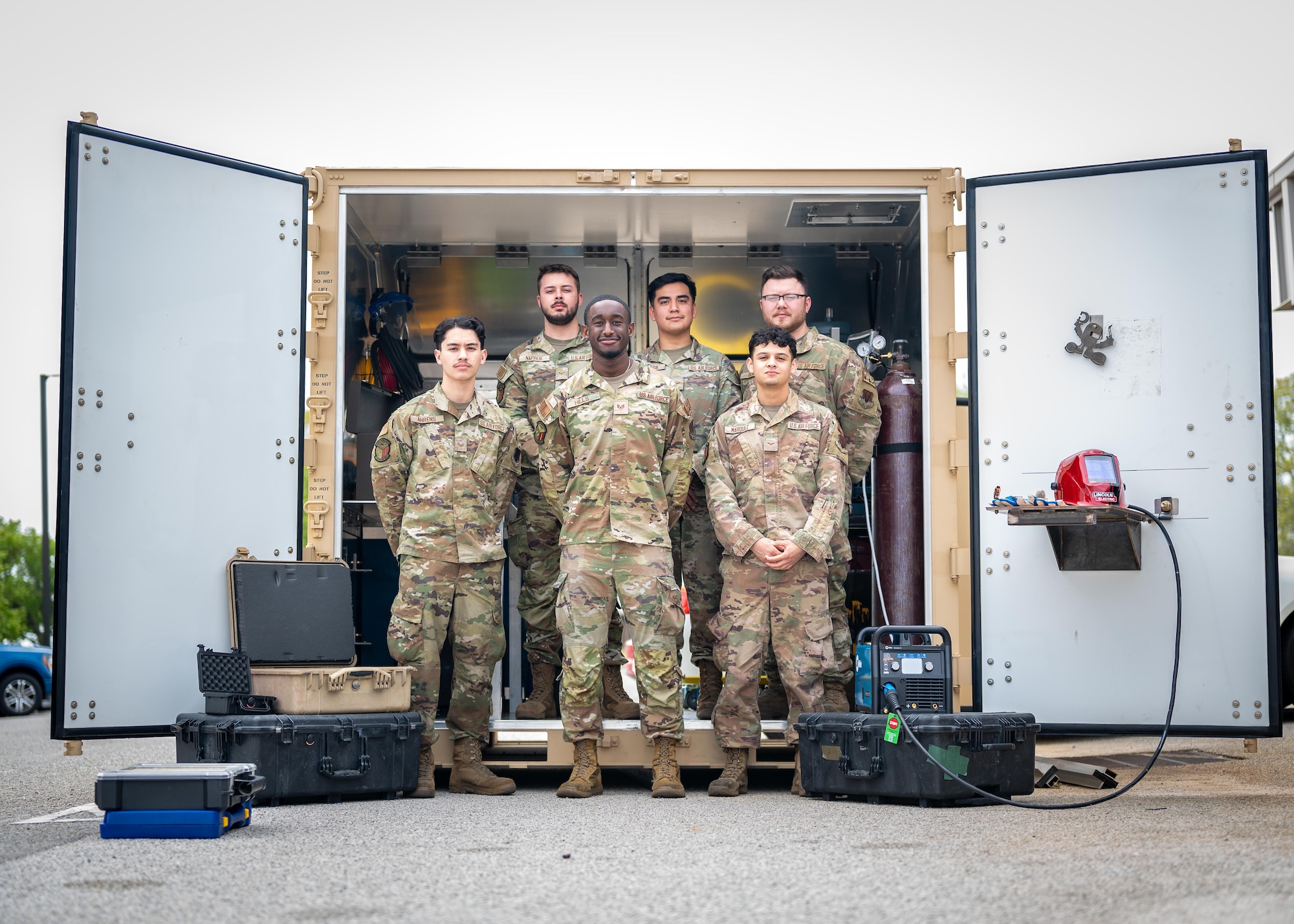 A group of Airmen pose for a photo