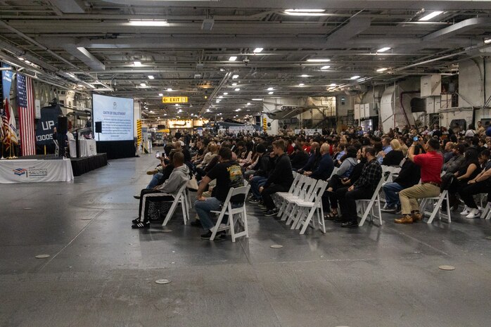 High school seniors, military service members and their families attend Our Community Salutes San Diego 2024 at the USS Midway Museum in San Diego, Calif., May 20, 2024. The Our Community Salutes program recognizes and supports high school seniors who plan to enlist into the military immediately after high school graduation, and provide them with resources that aid in their transition into military service. (U.S. Marine Corps photo by Sgt. Jesula Jeanlouis)