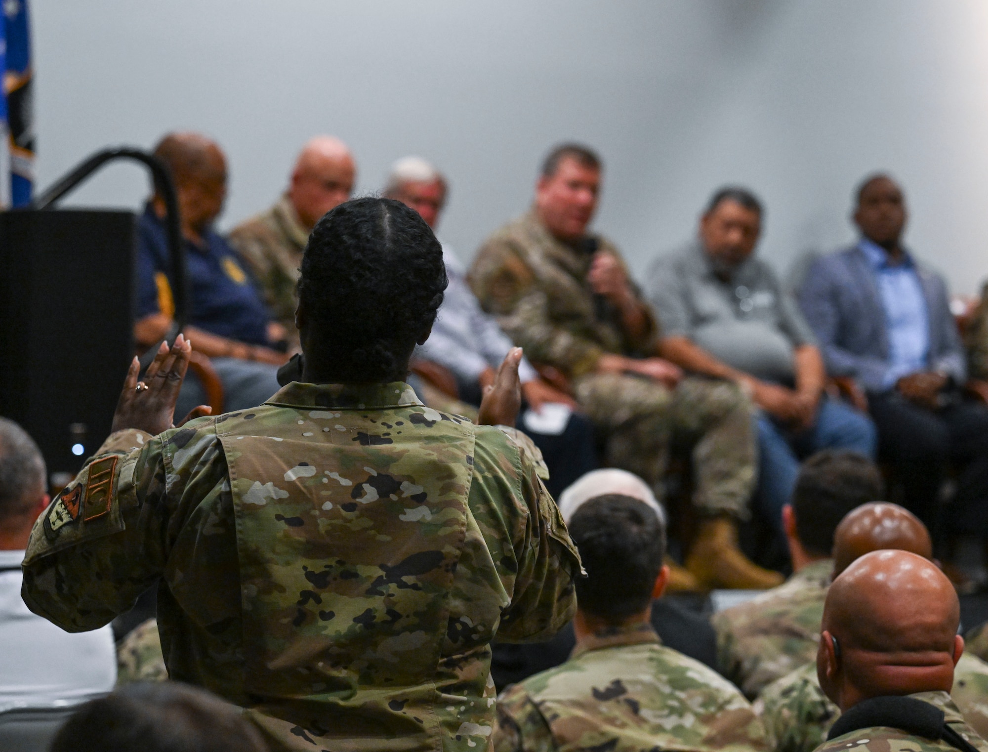 An Air Commando addresses the panel during a town hall at Hurlburt Field, Florida, May 30, 2024. Air Force Special Operations Command leadership, along with community leaders, held the town hall to discuss the recent shooting incident involving an Okaloosa County Sheriff’s Department deputy resulting in the death of SrA Roger Fortson May 3rd. (U.S. Air Force photo by Staff Sgt. Caleb Pavao)