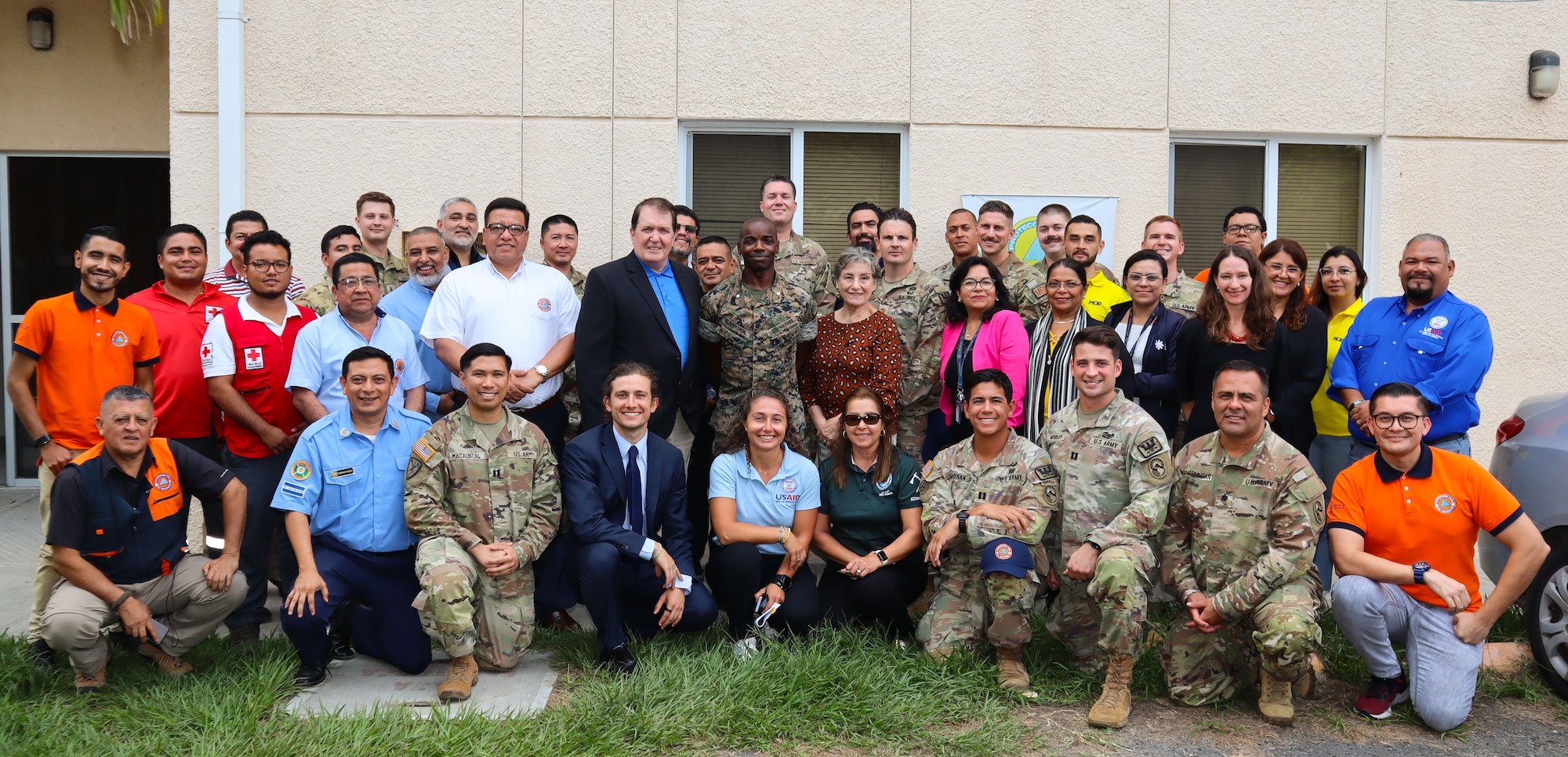 A photo of a group of people smiling.