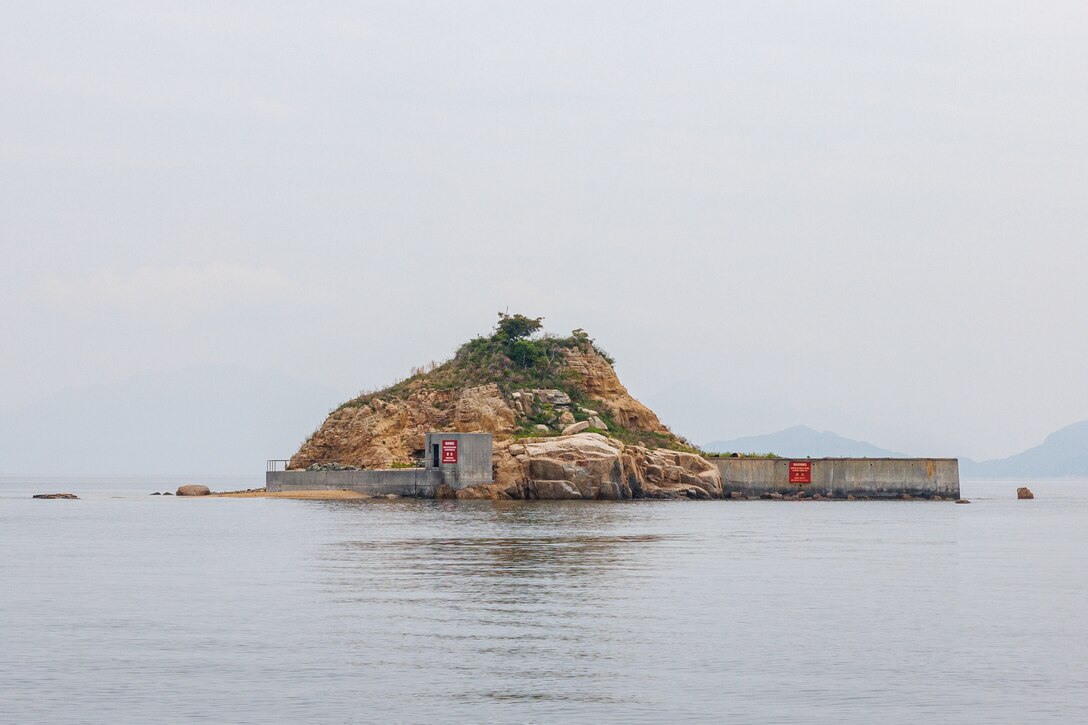 Target Island, seen here, is a location isolated from Marine Corps Air Station Iwakuni that is routinely used for explosive training by the U.S. Marine explosive ordnance disposal technicians with Headquarters and Headquarters Squadron, MCAS Iwakuni, Japan, May 23, 2024. EOD trains regularly to ensure personnel understand proper handling of explosives and are able to rapidly and safely respond to threats to prevent any interruptions to base operations and protect surrounding areas, wherever they may be. (U.S. Marine Corps photo by Lance Cpl. David Getz)