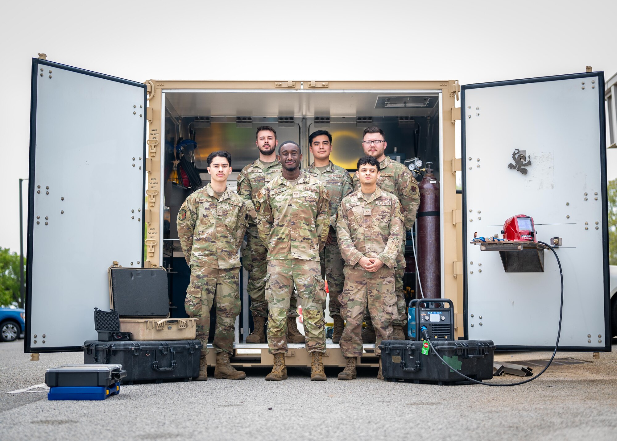 A group of Airmen pose for a photo