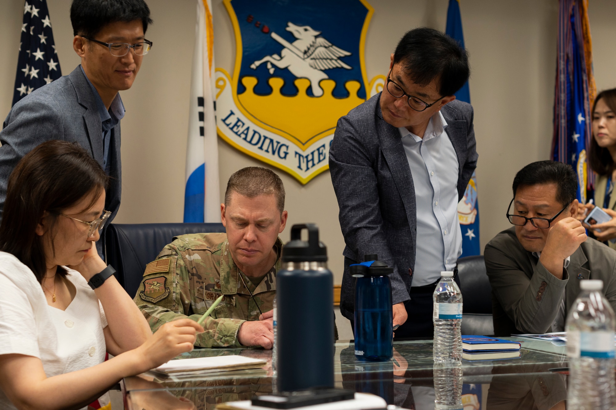 51st Fighter Wing leaders and Songtan city officials review environmental concerns during the Osan Air Base and Songtan Community Advisory Council meeting at Osan AB, Republic of Korea, May 30, 2024. Establishing and nurturing a cooperative partnership with the city of Songtan is vital for Osan AB, facilitating collaboration and mutual support between military and civilian entities enables the achievement of common objectives and benefits both the base and the local community. (U.S. Air Force photo by Senior Airman Kaitlin Frazier)