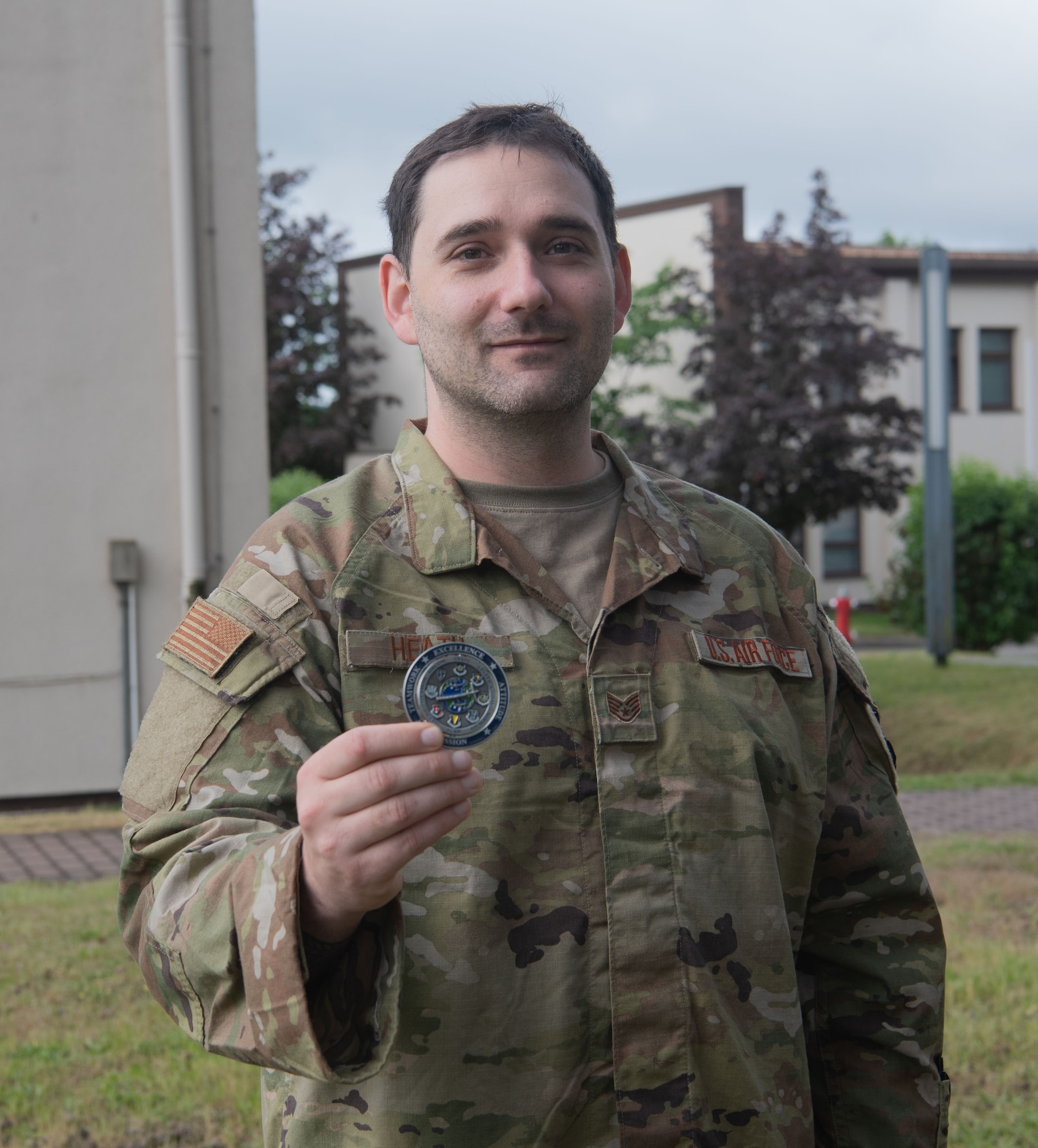 Man holds out coin