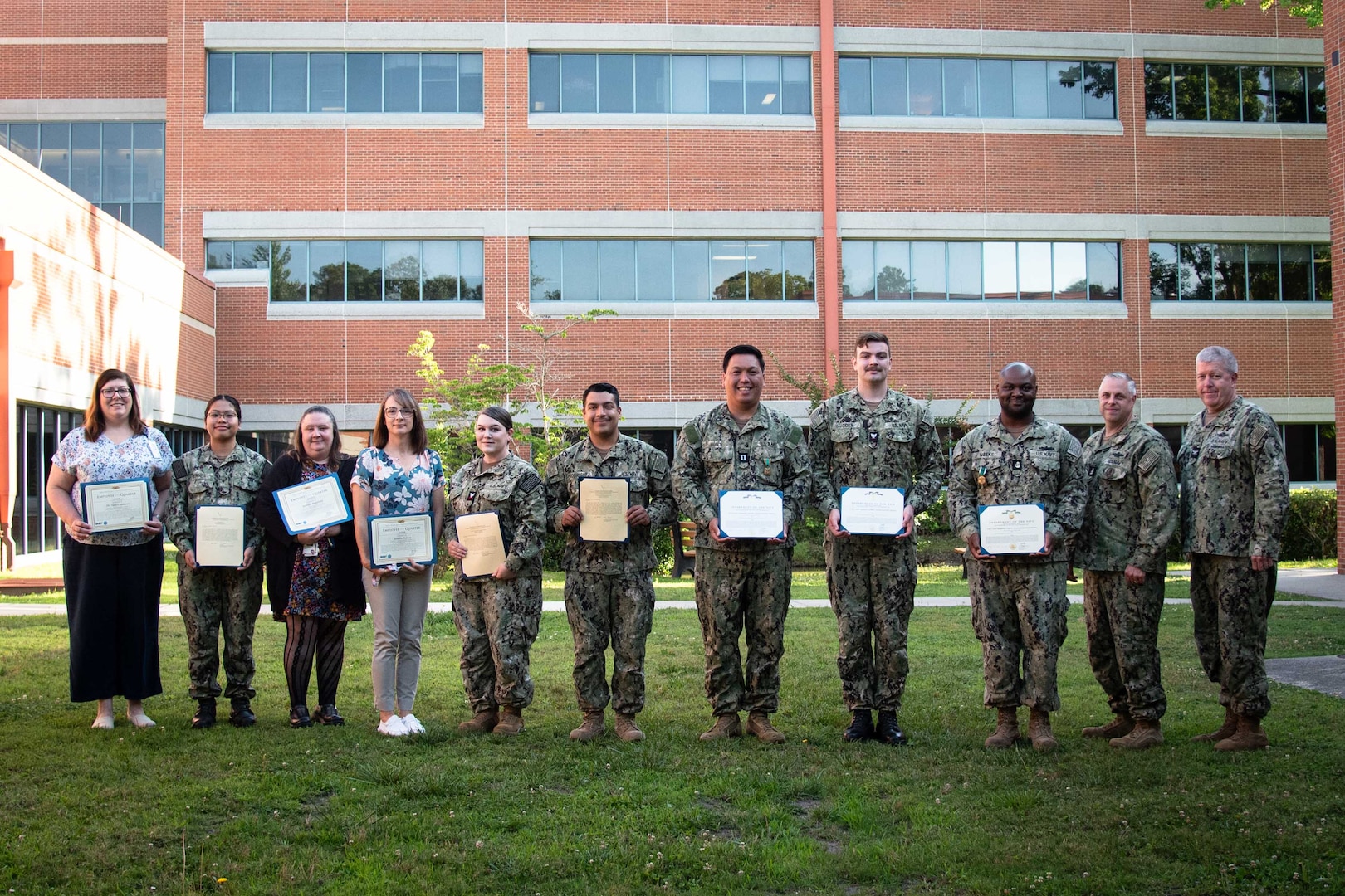 Staff serving aboard Naval Health Clinic Cherry Point celebrated the retirement of a Chief Petty Officer and the accomplishments of Sailors and civilians during a ceremony conducted Wednesday, May 29 aboard the Clinic.

From left to right, recognized during the ceremony were; Dr. Tonya Andrews, Senior Employee of the Quarter Hospitalman Ma Angeline Viernes – Flag Letter of Commendation, Ms. Jennifer Hartsfield, Mid-Level Employee of the Quarter, Ms. Jennifer Nelson, Junior Employee of the Quarter, Hospital Corpsman Second Class Ashlyn Sanders – Flag Letter of Commendation, Hospital Corpsman Third Class Miguel Rodriguez – Flag Letter of Commendation ,Lieutenant Jan Bosch -  Navy and Marine Corps Achievement Medal ,Hospital Corpsman Third Class Benjamin Alcorn - Navy and Marine Corps Achievement Medal, Chief Petty Officer Raymond Weeks - Navy and Marine Corps Commendation Medal.