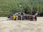Washington Army National Guard aviation crew members and Central Pierce County Fire and Rescue near Crystal Mountain Ski Resort in Washington, May 15, 2024. The Guard and first responders trained on air rescue operations.