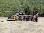 Washington Army National Guard aviation crew members and Central Pierce County Fire and Rescue near Crystal Mountain Ski Resort in Washington, May 15, 2024. The Guard and first responders trained on air rescue operations.