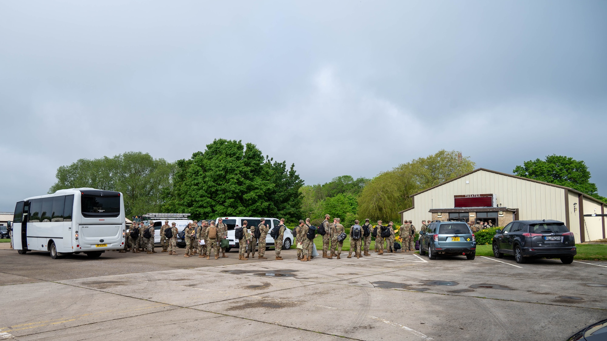 Airmen from Minot Air Base wait to in-process outside of a base theater at RAF Fairford