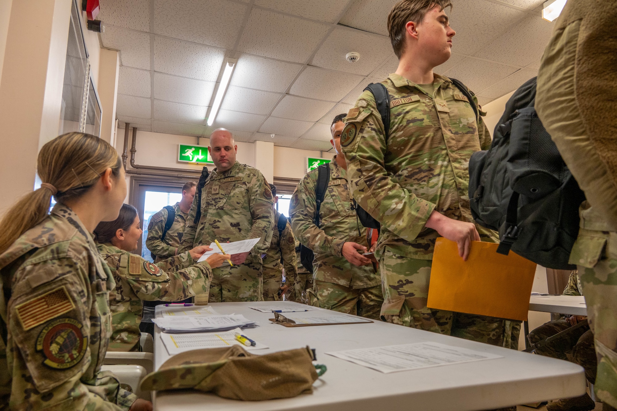 Airmen from Minot Air Base in-process inside of the base theater at RAF Fairford