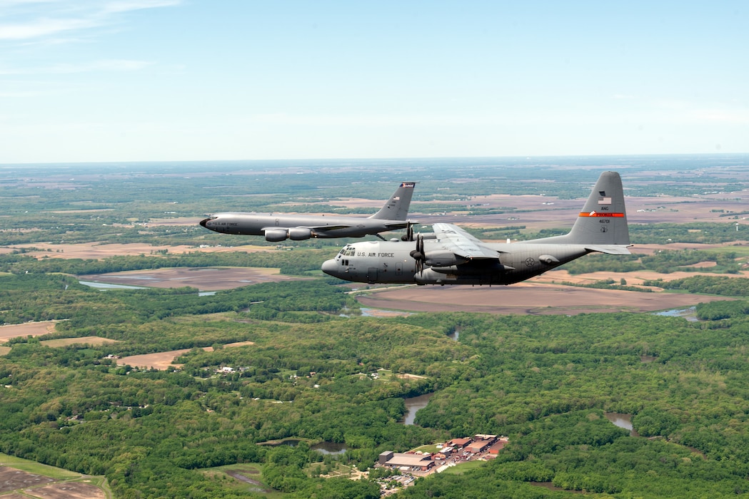 A 182nd Airlift Wing C-130H Hercules and a 126th Air Refueling Wing KC-135R Stratotanker fly a formation on approach