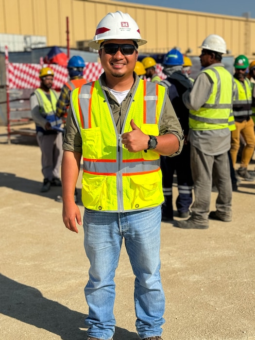 Man standing wearing PPE.