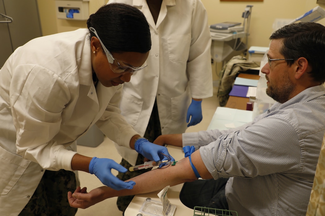 BETHESDA, Md. (May 10, 2024) Hospital Corpsman 1st Class Adirachel Sauvou, from Naval Medical Research Command (NMRC), draws a blood samples as part of training for a flu prevention study. The study, an ongoing trial conducted by the NMRC Clinical Trials Center (CTC), evaluates the efficacy of SAb Biotherapeutics therapy SAB-176, a novel infectious disease therapy designated by the U.S. Food and Drug Administration. According to the Centers for Disease Control and Prevention, more than 14,000,000 medical visits, 360,000 hospitalizations and 21,000 deaths occurred in the United States due to influenza from 2022-2023. Influenza outbreaks can spread easily among active-duty service members, especially those living in congregate settings, reducing mission readiness. A prevention option that can be administered remotely could reduce disease burden and optimize health and operational readiness of Navy, Marine Corps and joint service personnel in all domains that may face a rapidly transmitted infectious disease threat.

This study is open to all healthy active-duty military, dependents, retirees, WRNMMC personnel and other local individuals between the ages of 18 and 60. Participants must not be pregnant, cannot have received a flu shot in the past 90 days and must be able to complete at least eight visits to the CTC over the course of three months. Active-duty personnel will be required to complete a supervisor’s approval form. Participants may be eligible for compensation. If you would like to participate or have any questions, please contact the center at 301-233-9640 (text), or via e-mail at usn.nmrc.ctc@health.mil to schedule an appointment. The CTC, located at Naval Support Activity Bethesda, Building 17B (2nd floor), evaluates vaccines, therapeutics, prophylactics and medical devices in human subjects to advance products from the laboratory to the front line and maximize the medical readiness of the warfighter. (U.S. Navy photo by Sidney Hinds/Released)