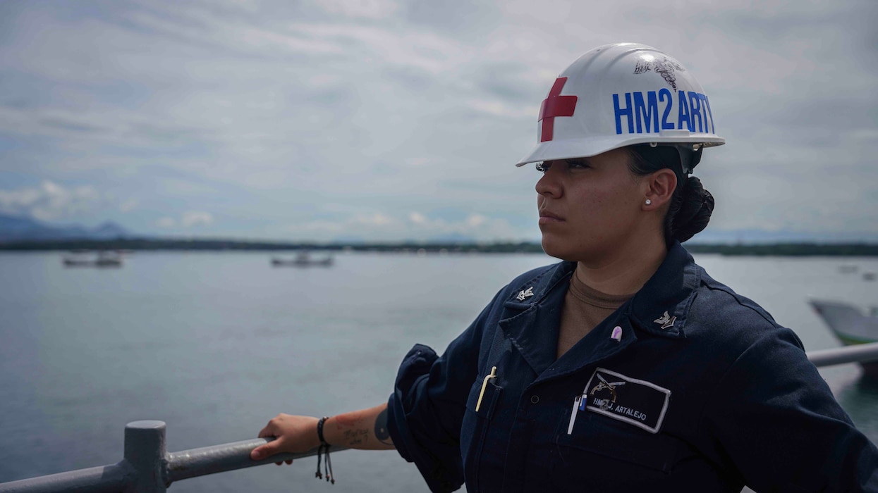 240527-N-HV010-1012 Hospital Corpsman 2nd Class Jenny Artalejo, from El Paso, Texas, observes the forecastle of the amphibious dock landing ship USS Harpers Ferry (LSD 49) as the ship departs Puerto Princesa, Philippines, May 27, 2024. Harpers Ferry and embarked elements of the 15th MEU are conducting routine operations in the U.S. 7th Fleet area of operations. U.S. 7th Fleet is the U.S. Navy’s largest forward-deployed numbered fleet, and routinely interacts and operates with allies and partners in preserving a free and open Indo-Pacific region. (U.S. Navy photo by Mass Communication Specialist 2nd Class Sang Kim)