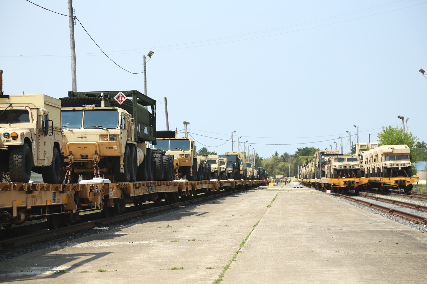Soldiers with the Wisconsin National Guard’s 32nd Infantry Brigade Combat Team (IBCT) conduct a rail movement May 14, 2024, that includes more than 800 pieces of equipment on nearly 200 railcars at the railyard at Fort McCoy, Wis. Warrant Officer 1 Eric Frank with the 32nd IBCT who helped plan the movement, said this was “the largest rail movement with civilian linehaul the Wisconsin National Guard has ever done.” The 32nd is completing the operation to move the vehicles and equipment for a future training rotation. Unit movement officers with the 32nd coordinated the plans to complete the movement. Fort McCoy’s Logistics Readiness Center Transportation Division and associated rail operations team personnel supported the effort. (U.S. Army Photo by Scott T. Sturkol, Public Affairs Office, Fort McCoy, Wis.)
