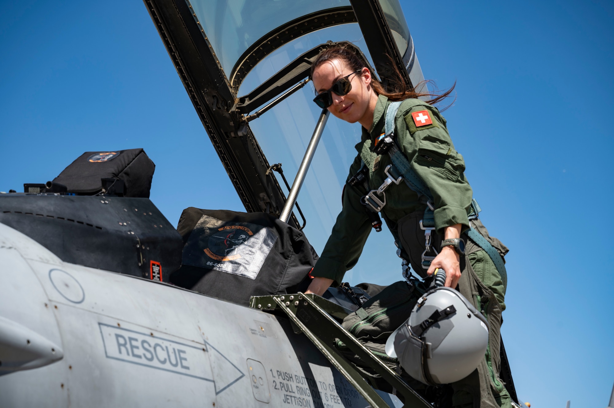 Capt. Fanny Chollet, Swiss Air Force Test Pilot Student, prepares for a flight for Air Force Test Pilot School located at Edwards Air Force Base. After graduating from Air Force Test Pilot School on June 8, 2024, she will be the first female Swiss Air Force test pilot. Chollet is also the first female fighter pilot for the Swiss Air Force.  (Air Force Photo by Mary Kozaitis)