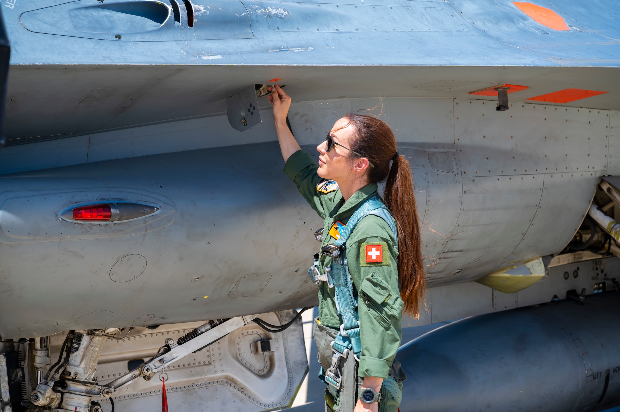 Capt. Fanny Chollet, Swiss Air Force Test Pilot Student, prepares for a flight for Air Force Test Pilot School located at Edwards Air Force Base. After graduating from Air Force Test Pilot School on June 8, 2024, she will be the first female test pilot. Capt. Chollet is also the first female fighter pilot for the Swiss Air Force.  (Air Force Photo by Mary Kozaitis)