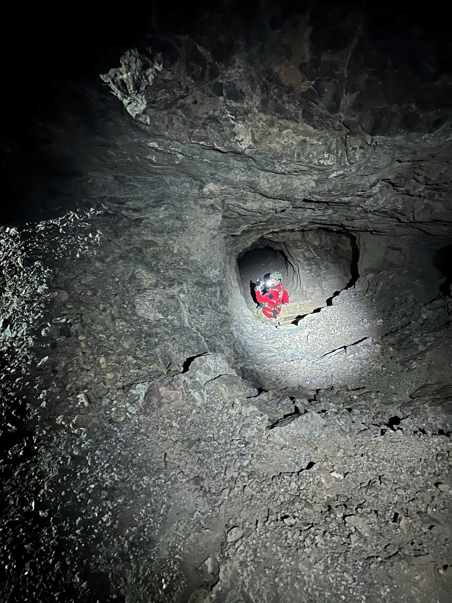 A U.S. Airman assigned to the 48th Rescue Squadron rope repels into a mineshaft, Yuma, Ariz., April 7, 2024. The 563rd Rescue Group coordinated efforts to save a woman who fell down 200 feet into a mineshaft.