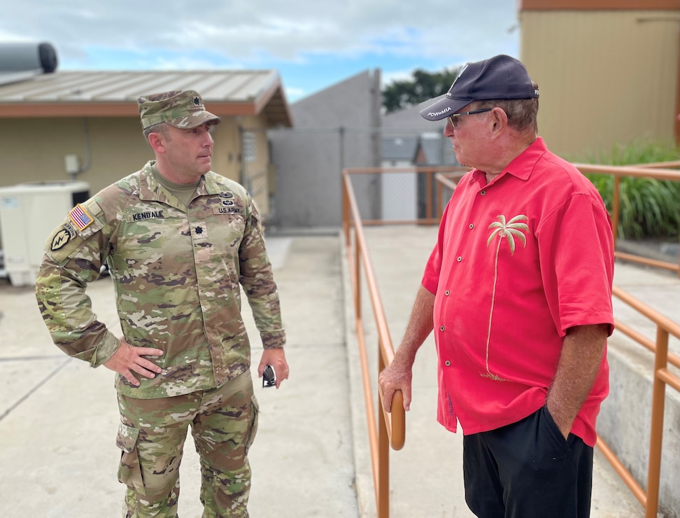 Lt. Col. Joseph Kendall, Honolulu District deputy commander, left, speaks with Waikoloa Maneuver Area Formerly Used Defense Site Restoration Advisory Board member Peter Hoffmann during the spring 2024 RAB meeting in Waikoloa Village on the Island of Hawaii, May 22, 2024.