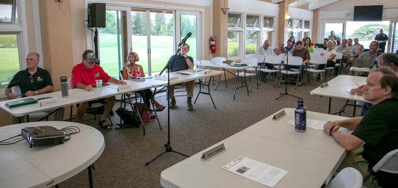 Lt. Col. Joseph Kendall, Honolulu District deputy commander, left, speaks with Waikoloa Maneuver Area Formerly Used Defense Site Restoration Advisory Board member Peter Hoffmann during the spring 2024 RAB meeting in Waikoloa Village on the Island of Hawaii, May 22, 2024.