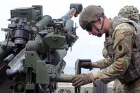 Spc. Michael Hawkins, with B Battery, 2nd Battalion, 123rd Field Artillery Regiment, Illinois Army National Guard, adjusts the elevation of an M777 155mm howitzer while executing a fire mission during exercise Immediate Response in Ustka, Poland, May 11, 2024. More than 10,400 U.S. military members and 12,750 service members from Allied and partner nations are participating in the exercise, which includes live-fire exercises, wet gap crossings, and other training to strengthen interoperability among participants.