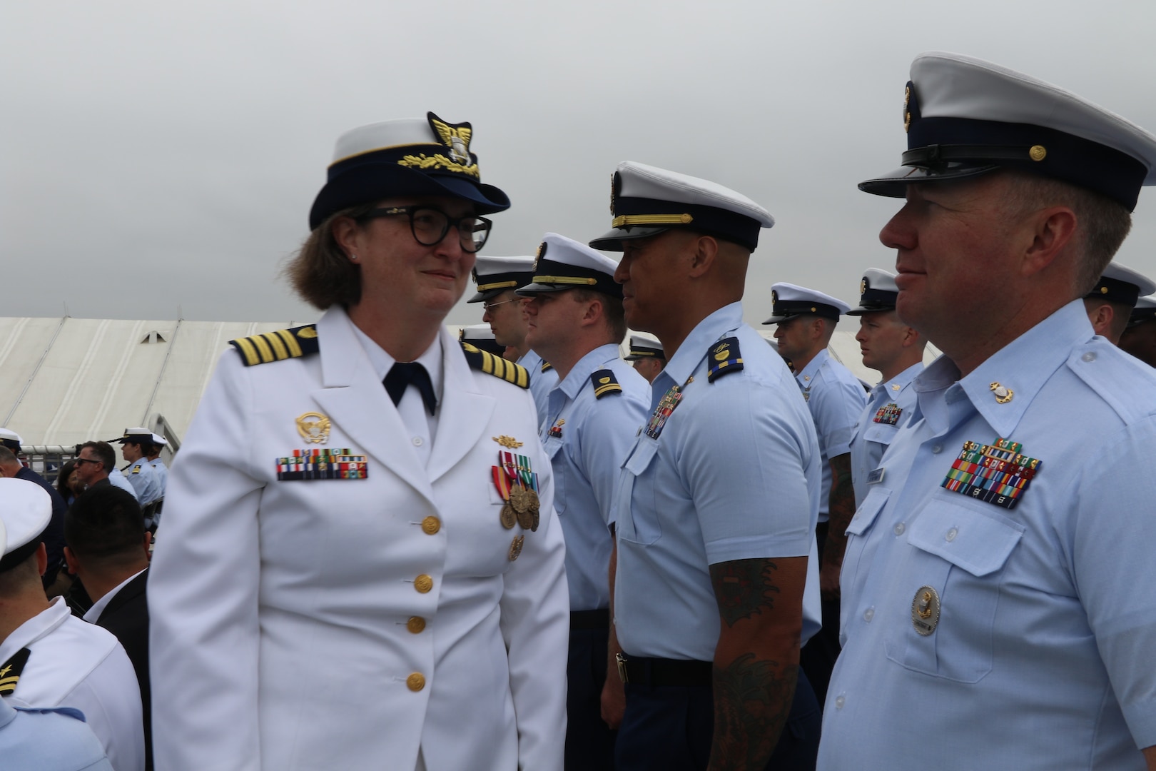 Capt. Rula Deisher (pictured) and Capt. James O’Mara conduct a personnel inspection during the U.S. Coast Guard Cutter Munro’s (WMSL 755) change of command ceremony in San Diego, May 30, 2024. Vice Adm. Andrew J. Tiongson, Commander, U.S. Coast Guard Pacific Area, presided over the ceremony in which O’Mara relieved Deisher as Munro’s commanding officer. U.S. Coast Guard photo by Ensign Samika Lewis.