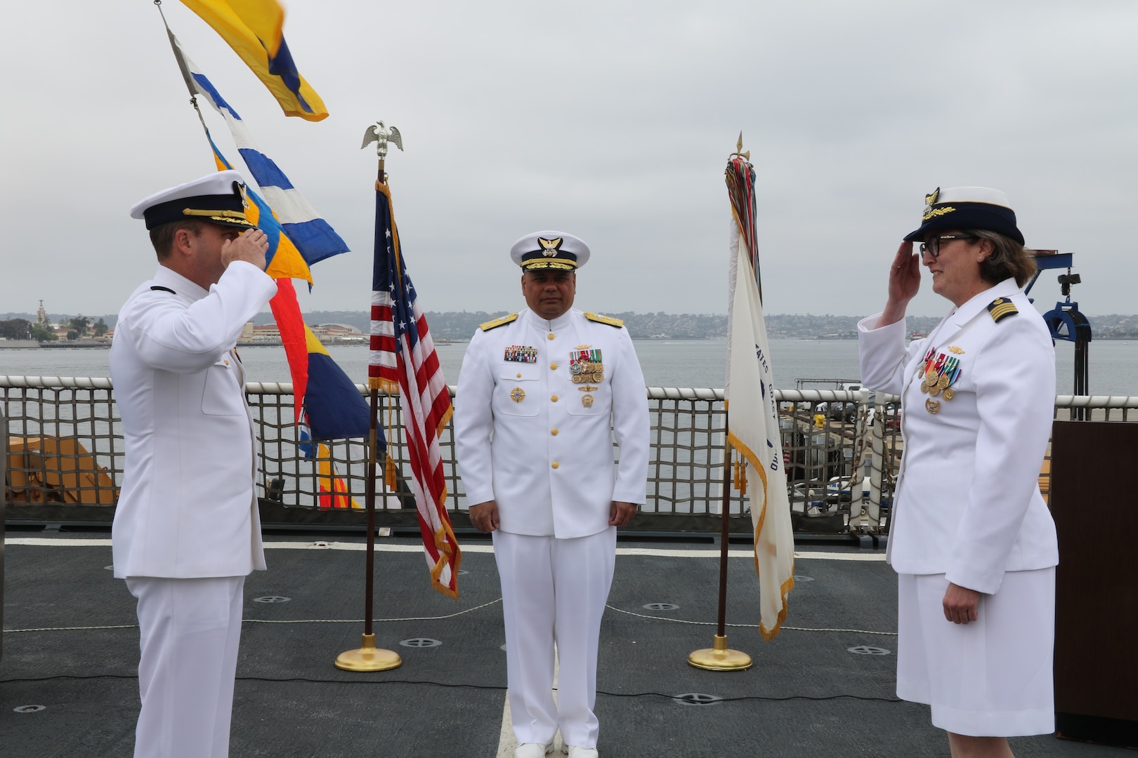 Capt. James O’Mara (left) and Capt. Rula Deisher (right) salute each other during the U.S. Coast Guard Cutter Munro’s (WMSL 755) change of command ceremony in San Diego, May 30, 2024. Vice Adm. Andrew J. Tiongson, Commander, U.S. Coast Guard Pacific Area, presided over the ceremony in which O’Mara relieved Deisher as Munro’s commanding officer. U.S. Coast Guard photo by Ensign Samika Lewis.