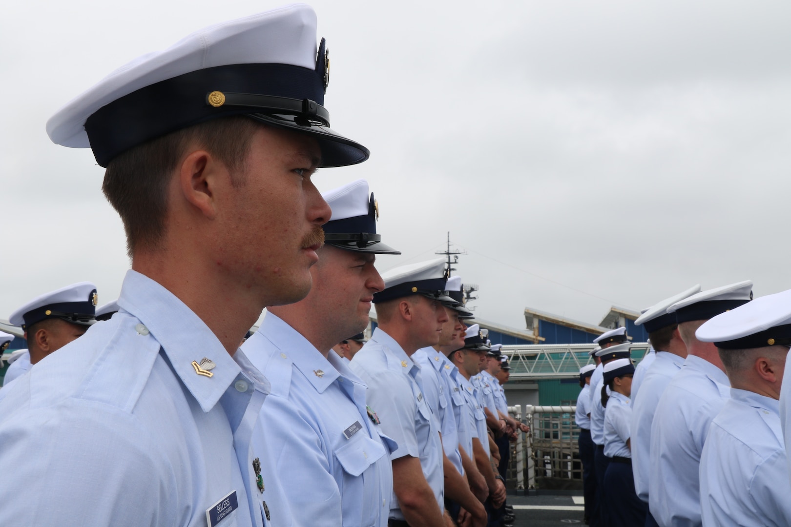 U.S. Coast Guard Cutter Munro’s (WMSL 755) crewmembers file in during the Munro’s change of command ceremony on May 30, 2024. Vice Adm. Andrew J. Tiongson, Commander, U.S. Coast Guard Pacific Area, presided over the ceremony in which Capt. James O’Mara relieved Capt. Rula Deisher as Munro’s commanding officer. U.S. Coast Guard photo by Ensign Samika Lewis.