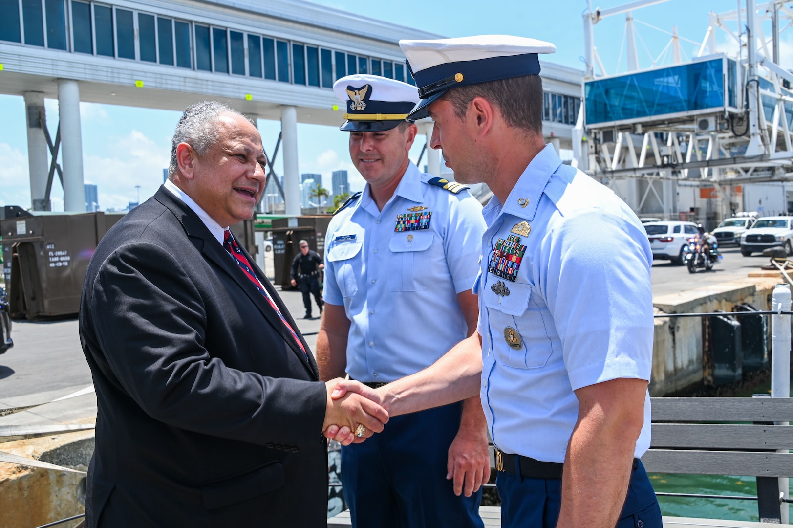 Secretary of the Navy Carlos Del Toro greets USCGC Seneca (WMEC 906) executive officer Lt. Cmdr. Bryan Kilcoin and Chief Petty Officer Edward Hinshelwood-Ahmann during a brief visit to the medium endurance cutter at PortMiami during Fleet Week Miami May 7, 2024. Del Toro is the 78th Secretary of the Navy and is responsible for over 900,000 Sailors, Marines, reservists, and civilian personnel. (U.S. Coast Guard photo by Petty Officer 2nd Class Diana Sherbs)
