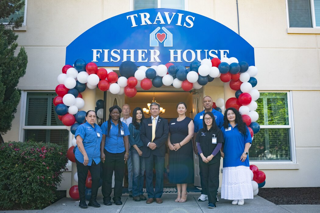 a group photo of the Fisher House at Travis