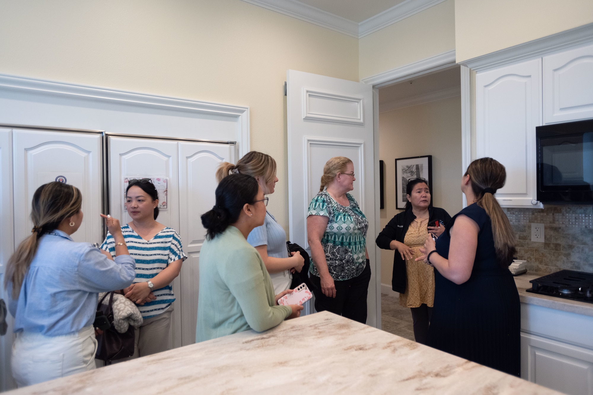 Fisher House guests gather in the kitchen