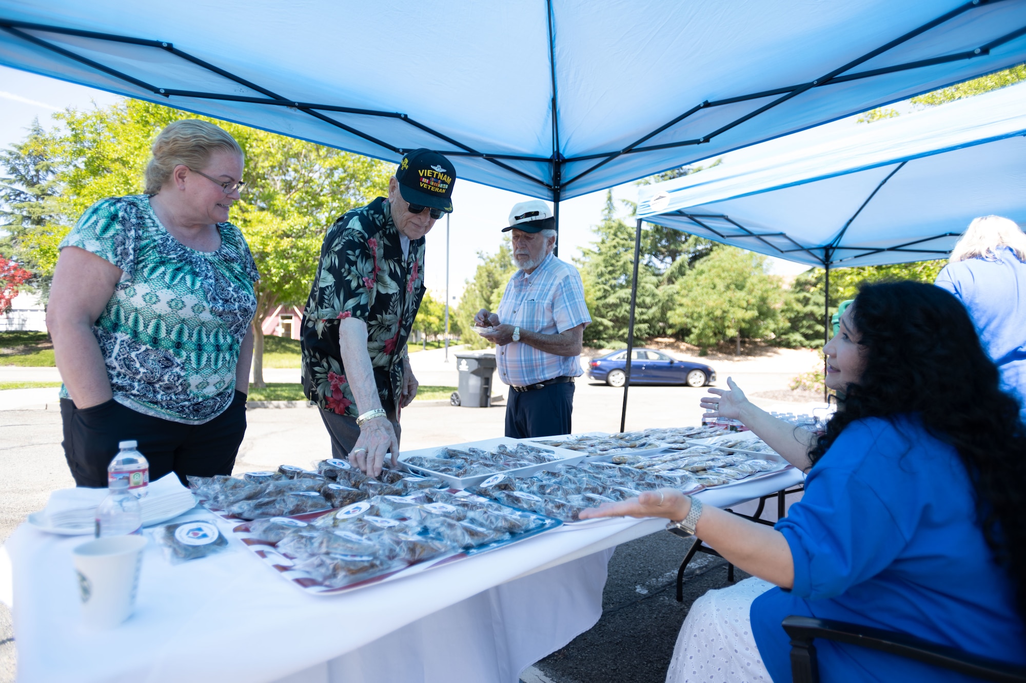 guests at Fisher House grab cookies at an event