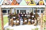 Papua New Guinea Defence Force members, U.S. Department of Defense personnel and an Australian Army Soldier, pose for a group photo following a Women, Peace and Security Gender Focal Point course graduation at the Kumul Learning Center, Murray Barracks, Port Moresby, Papua New Guinea, May 24, 2024. The course was facilitated by the PNGDF Gender Committee with support from the U.S. Indo-Pacific Command’s Office of WPS, and trained gender advisors with U.S. Air Force Wisconsin Air National Guard, and U.S. Marine Corps Marine Rotational Force – Darwin 24.3. The PNGDF Gender Committee focused on equipping defence force personnel with the tools necessary to integrate gender perspectives into their operational strategies to enhance PNGDF institutional and organizational effectiveness. (U.S. Marine Corps photo by Gunnery Sgt. Kassie McDole)