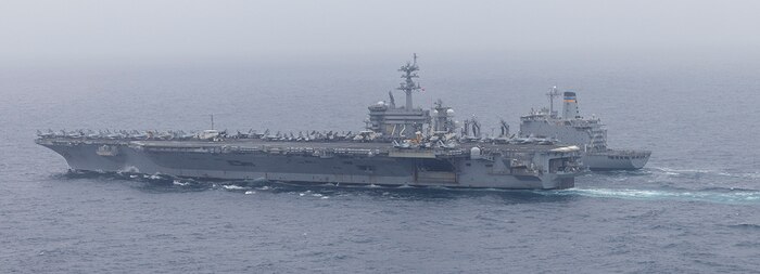 (May 30, 2024) Nimitz-class aircraft carrier USS Abraham Lincoln (CVN 72) conducts a replenishment-at-sea with the Henry J. Kaiser-class fleet replenishment oiler USNS Pecos (T-AO 197). Abraham Lincoln, flagship of Carrier Strike Group Three, is underway conducting integrated exercises to bolster strike group readiness and capability in the U.S. 3rd Fleet area of operations. (U.S. Navy photo by Mass Communication Specialist 1st Class Jerome D. Johnson)