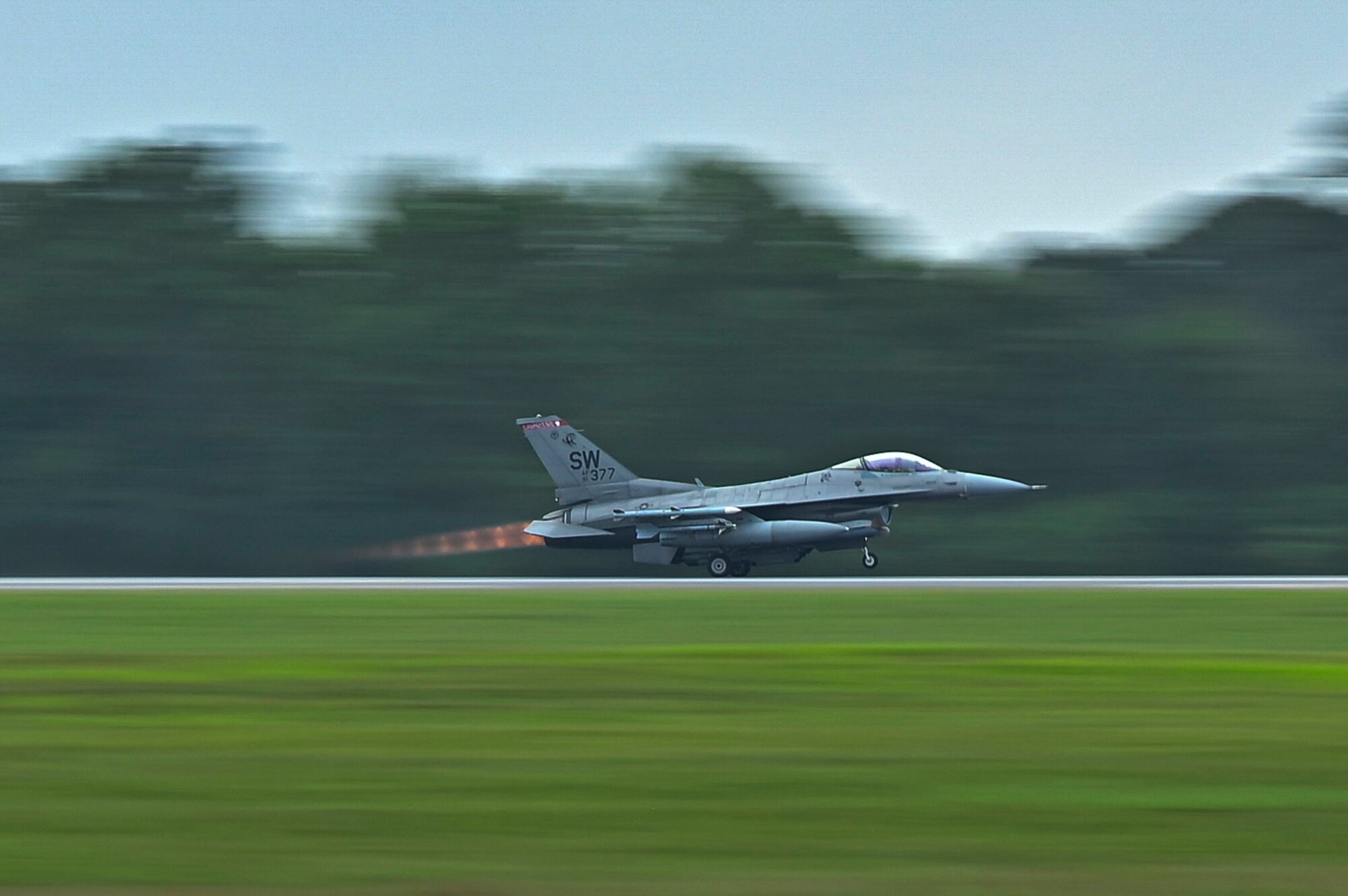 A jet take off the flightline.