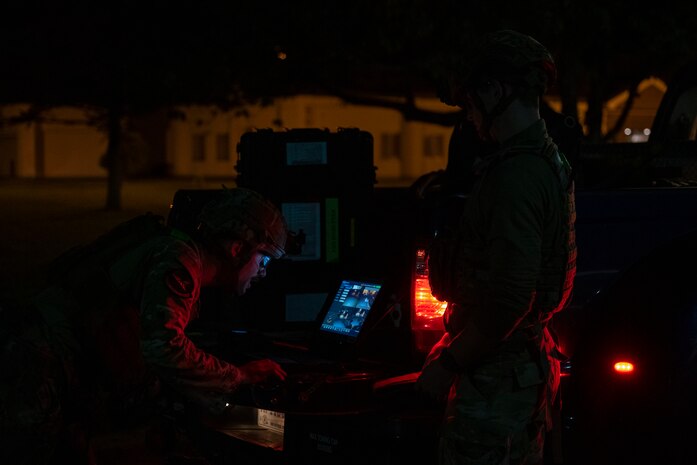 U.S. Air Force Senior Airman Justin Chamberlain, left, and Airman 1st Class Liam Brennan, 35th Civil Engineer Squadron explosive ordnance disposal technicians, operate a Man Transportable Robotics System.