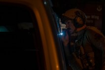 U.S. Air Force Tech. Sgt. Dale Janik, 35th Civil Engineer Squadron explosive ordnance disposal team leader, inspects a van with simulated unexploded ordnance.