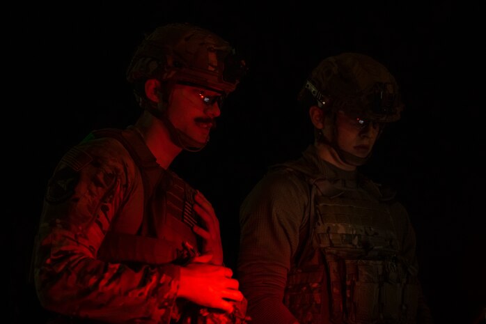 U.S. Air Force Senior Airman Justin Chamberlain, left, and Airman 1st Class Liam Brennan, 35th Civil Engineer Squadron explosive ordnance disposal technicians, operate a Man Transportable Robotics System.