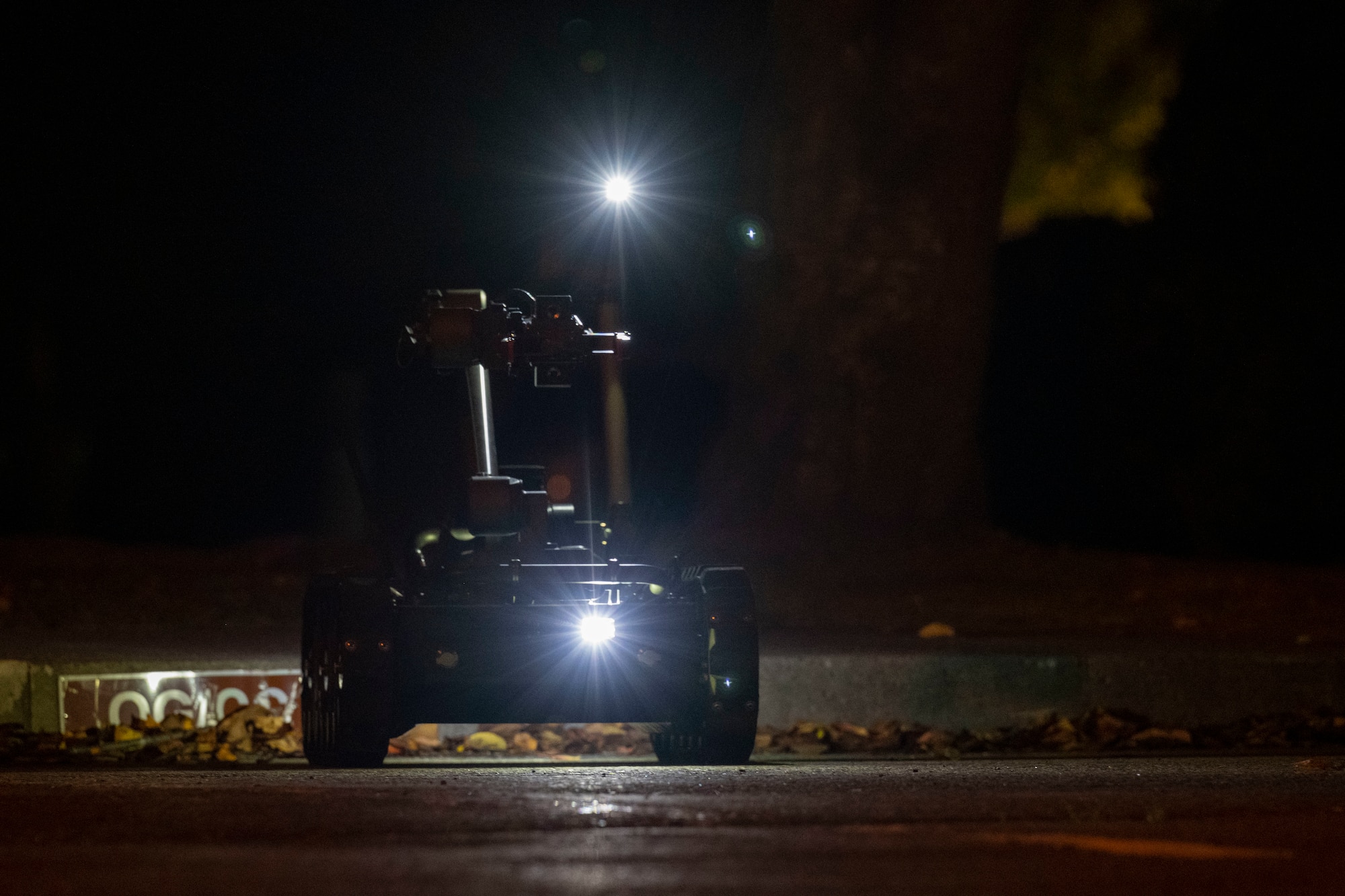 A Man Transportable Robotics System utilized by the 35th Civil Engineer Squadron Explosive Ordnance Disposal flight, approaches a simulated unexploded ordnance.