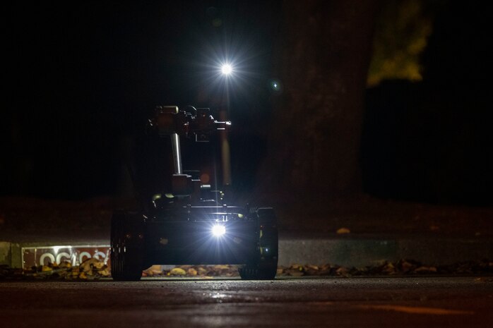 A Man Transportable Robotics System utilized by the 35th Civil Engineer Squadron Explosive Ordnance Disposal flight, approaches a simulated unexploded ordnance.