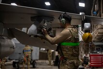 A U.S. Air Force Airman assigned to the 35th Maintenance Group inspects an armament attachment point on an F-16 Fighting Falcon during the Beverly Sunrise 24-6 exercise at Misawa Air Base, Japan, Oct. 24, 2024.