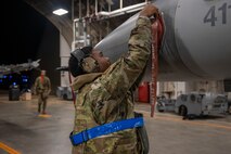 A U.S. Air Force Airman assigned to the 35th Maintenance Group places a cap on an F-16 Fighting Falcon Jet during the Beverly Sunrise 24-6 exercise at Misawa Air Base, Japan, Oct. 24, 2024.