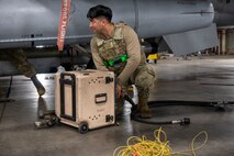 A U.S. Air Force Airman assigned to the 35th Maintenance Group inspects hookups for an F-16 Fighting Falcon during the Beverly Sunrise 24-6 exercise at Misawa Air Base, Japan, Oct. 24, 2024.