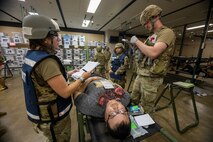 U.S. Air Force medical personnel assigned to the 35th Medical Group simulate taking an x-ray of a casualty actor during the Beverly Sunrise 24-6 exercise at Misawa Air Base, Japan, Oct. 24, 2024.